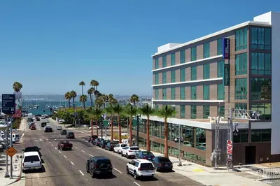 a city street with cars parked in front of a building at Hilton Garden Inn San Diego Downtown/Bayside, CA in San Diego