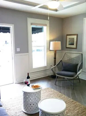 a living room with a couch a chair and a table at Newport Beach Hotel in Newport Beach