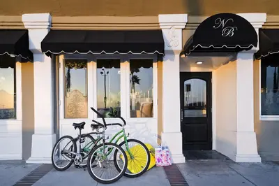two bikes parked in front of a building at Newport Beach Hotel in Newport Beach