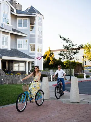 a man and a woman riding bikes down a street at Blue Lantern Inn, A Four Sisters Inn in Dana Point