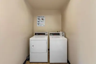 a room with two washers and a refrigerator in it at Best Western Country Inn Temecula in Temecula