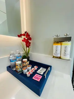 a blue tray with food and flowers on a counter at Villa Serena in El Cajon