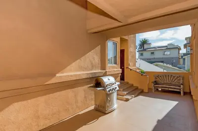 a balcony with a view of a building at Rooftop Deck Spectacular Ocean View M-A in Oceanside