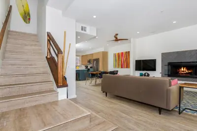 a living room with a couch and a fireplace at Ocean View Steps to Beach M-C in Oceanside