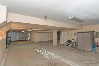 an empty garage with two bikes parked in it at Ocean View Steps to Beach M-C in Oceanside