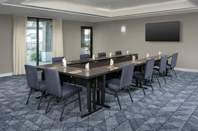 a conference room with a long table and chairs at Courtyard by Marriott San Diego Carlsbad in Carlsbad