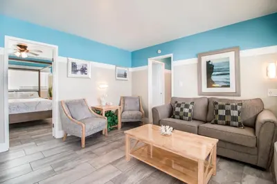 a living room with a couch and a table at The Inn at Sunset Cliffs in San Diego
