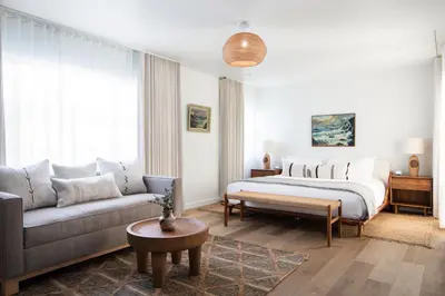 a living room with a bed and a couch at The Pearl Hotel in San Diego