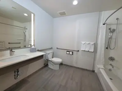 a bathroom with a toilet and a sink and a shower at Holiday Inn Express San Diego South - Chula Vista by IHG in Chula Vista