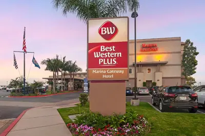 a sign in front of a west virginia plus store at Best Western Plus Marina Gateway Hotel in National City