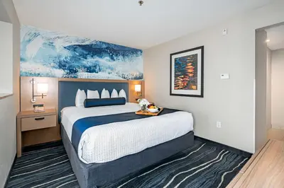 a hotel room with a large bed in it at Best Western Plus Marina Gateway Hotel in National City
