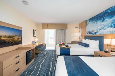 a hotel room with two beds and a desk at Best Western Plus Marina Gateway Hotel in National City