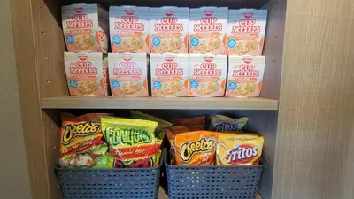 a refrigerator filled with lots of bags of food at SureStay Hotel by Best Western Chula Vista San Diego Bay in Chula Vista
