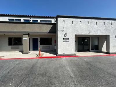 an empty parking lot in front of a building at Motel 6 Lake Elsinore, CA in Lake Elsinore
