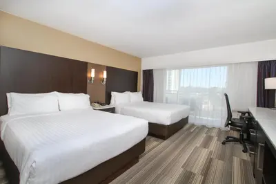 a hotel room with two beds and a desk at Holiday Inn Express - Downtown San Diego by IHG in San Diego