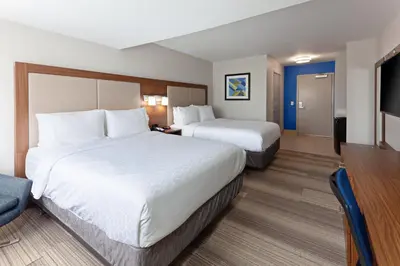 a hotel room with two beds and a flat screen tv at Holiday Inn Express Mira Mesa San Diego by IHG in Mira Mesa
