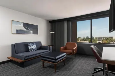 a living room with a couch and a chair at Courtyard by Marriott San Diego Miramar in San Diego