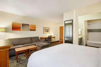 a hotel room with a bed and a couch at Sonesta ES Suites San Diego - Rancho Bernardo in Rancho Bernardo
