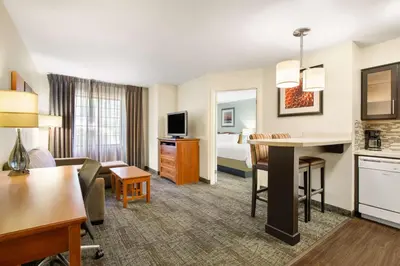 a hotel suite with a living room and a bedroom at Sonesta ES Suites San Diego - Rancho Bernardo in Rancho Bernardo