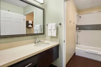 a bathroom with a sink and a mirror at Sonesta ES Suites San Diego - Rancho Bernardo in Rancho Bernardo