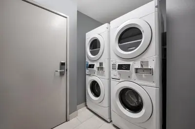a laundry room with two washer and dryer at Holiday Inn Express San Diego - Sea World Area by IHG in San Diego