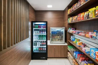 a grocery store aisle with a refrigerator in a store at Holiday Inn Express San Diego - Sea World Area by IHG in San Diego