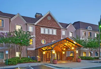 a home with an arbor in front of it at Sonesta ES Suites San Diego - Sorrento Mesa in Sorrento