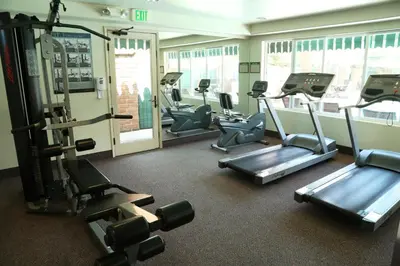 a gym with several tread machines in a room at Laguna Hills Lodge-Irvine Spectrum in Laguna Hills