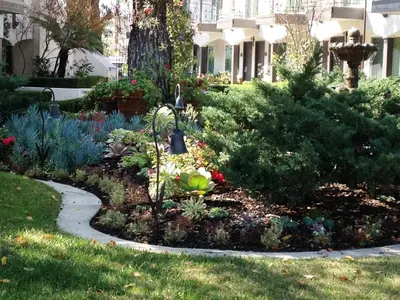 a garden with flowers and a walk way at Laguna Hills Lodge-Irvine Spectrum in Laguna Hills