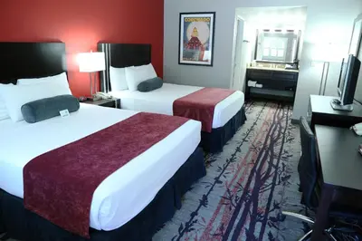 a hotel room with two beds and a television at Laguna Hills Lodge-Irvine Spectrum in Laguna Hills