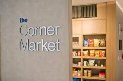 a sign that says the corner market on the door of a store at Fairfield Inn & Suites by Marriott San Diego Pacific Beach in San Diego