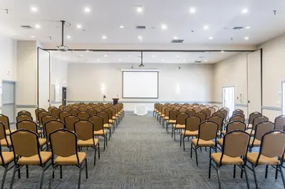 an empty room with a row of chairs and a screen at Holiday Inn Express San Clemente N – Beach Area by IHG in San Clemente