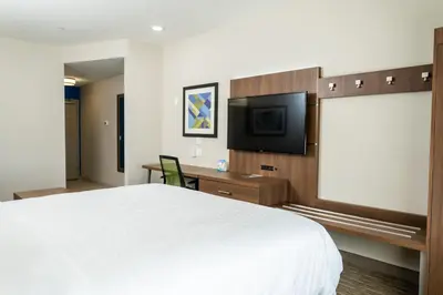 a hotel room with a bed and a flat screen tv at Holiday Inn Express San Clemente N – Beach Area by IHG in San Clemente