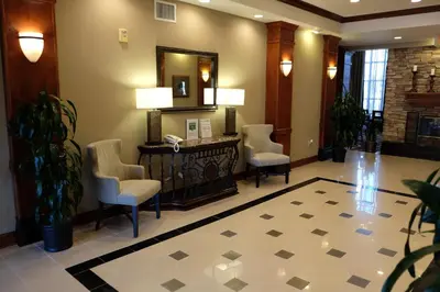 a waiting room with chairs and a mirror at Staybridge Suites Irvine East/Lake Forest by IHG in Lake Forest