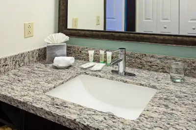 a bathroom counter with a sink and a mirror at Staybridge Suites Irvine East/Lake Forest by IHG in Lake Forest
