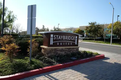 a sign for a shappett hotel suites on a street at Staybridge Suites Irvine East/Lake Forest by IHG in Lake Forest