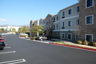 a street with cars parked in a parking lot at Staybridge Suites Irvine East/Lake Forest by IHG in Lake Forest