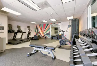 a gym with treadmills and exercise bikes in a room at Hilton Garden Inn Irvine East/Lake Forest in Foothill Ranch