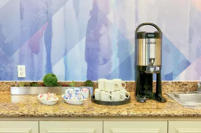 a kitchen counter with a blender and bowls of desserts at Hilton Garden Inn Irvine East/Lake Forest in Foothill Ranch