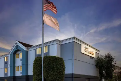 a flag flying in front of a hotel at Sonesta Simply Suites Irvine East Foothill in Lake Forest