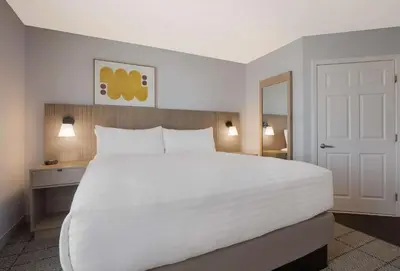 a large white bed in a hotel room at Sonesta Simply Suites Irvine East Foothill in Lake Forest
