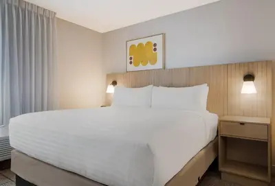 a large white bed in a hotel room at Sonesta Simply Suites Irvine East Foothill in Lake Forest