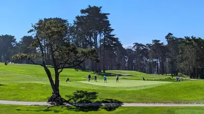 a group of people playing golf on a golf course at Holiday Inn Express Hotel & Suites Solana Beach-Del Mar by IHG in Solana Beach