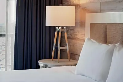 a lamp sitting on a table next to a bed at Hyatt Regency Mission Bay Spa and Marina in San Diego