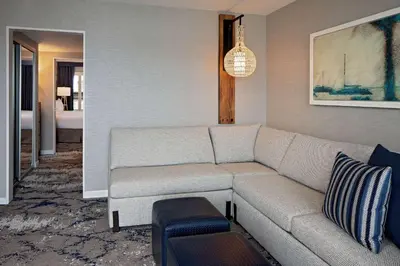 a living room with a couch and a room with a bedroom at Hyatt Regency Mission Bay Spa and Marina in San Diego