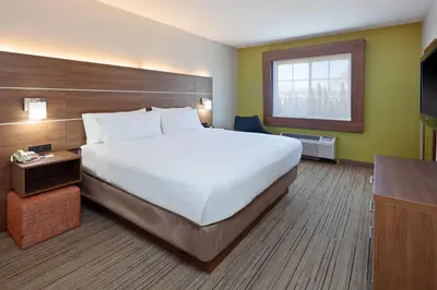 a hotel room with a large bed and a television at Holiday Inn Express Hotel & Suites San Diego-Escondido by IHG in Escondido