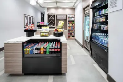 a store aisle with a display of drinks at Hilton Garden Inn Irvine Spectrum Lake Forest in Lake Forest