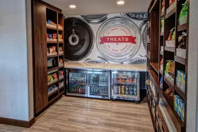 a grocery store with a treats sign on the wall at Hampton by Hilton Encinitas-Cardiff Encinitas, CA near Del Mar in Encinitas