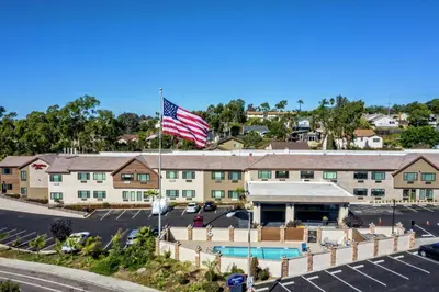 an american flag flying in front of a hotel at Hampton by Hilton Encinitas-Cardiff Encinitas, CA near Del Mar in Encinitas