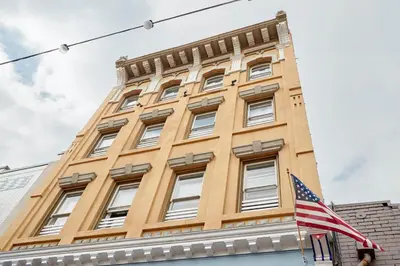 a building with an american flag in front of it at Kasa Gaslamp Quarter San Diego in San Diego